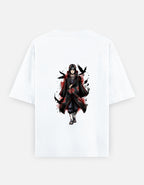 A white short-sleeve t-shirt with a graphic print of the anime character Itachi Uchiha in a black and red Akatsuki cloak, shown against a light gray background.