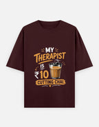 Brown t-shirt with a humorous graphic and text on a white background