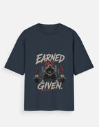 Navy blue t-shirt with bear lifting weights graphic and text 'Earned Not Given' on a white background
