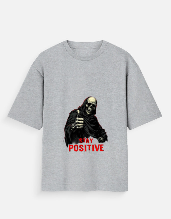 Gray t-shirt with a graphic of a skeleton and 'Stay Positive' text on a white background