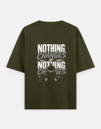 Green t-shirt with motivational quote on the back against a white background