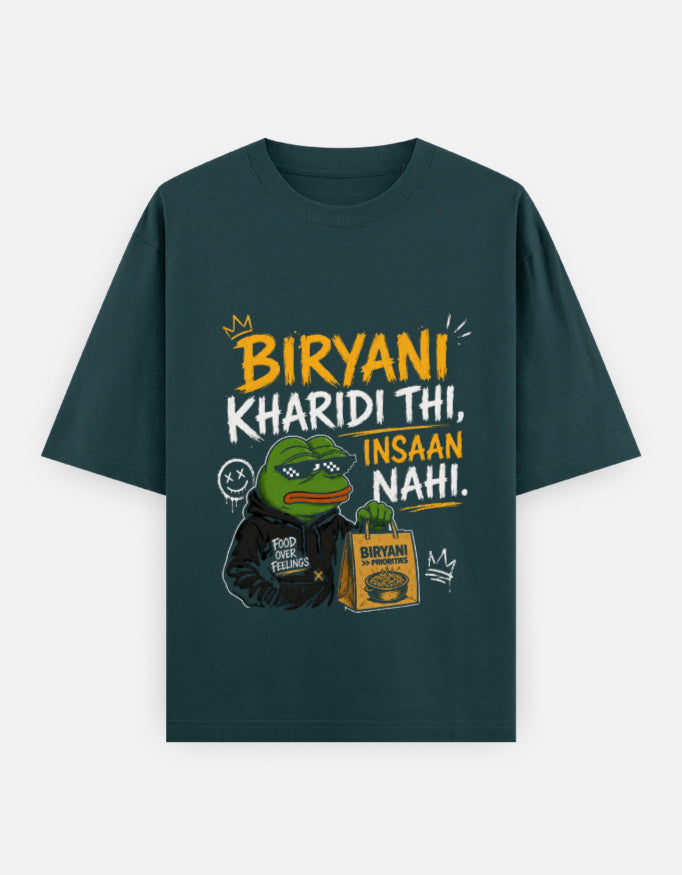 Green teal t-shirt with a graphic design featuring a character and text on a white background