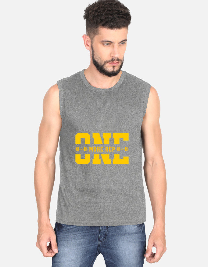 Man wearing a dark gray sleeveless shirt with yellow text on a white background