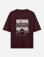 Maroon t-shirt with motivational quote on the back against a white background