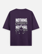 Purple t-shirt with motivational quote on the back against a white background
