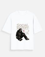 White T-shirt with graphic design of a person in a hoodie and text 'Social Battery: 1%' on a white background
