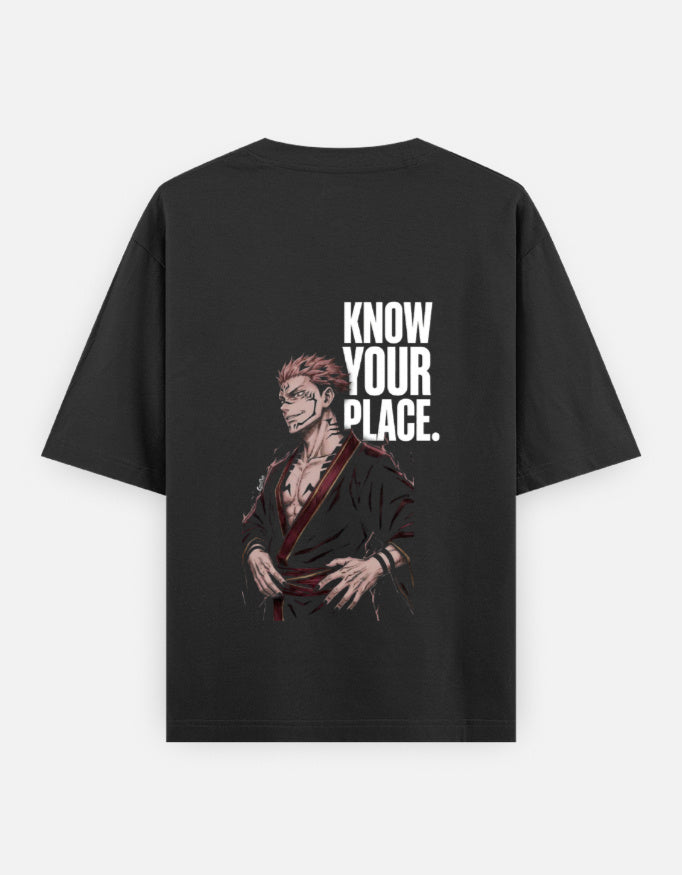 A black short-sleeve t-shirt with a graphic print of an anime character and the bold white text 'KNOW YOUR PLACE.' on the back, displayed against a light gray background.