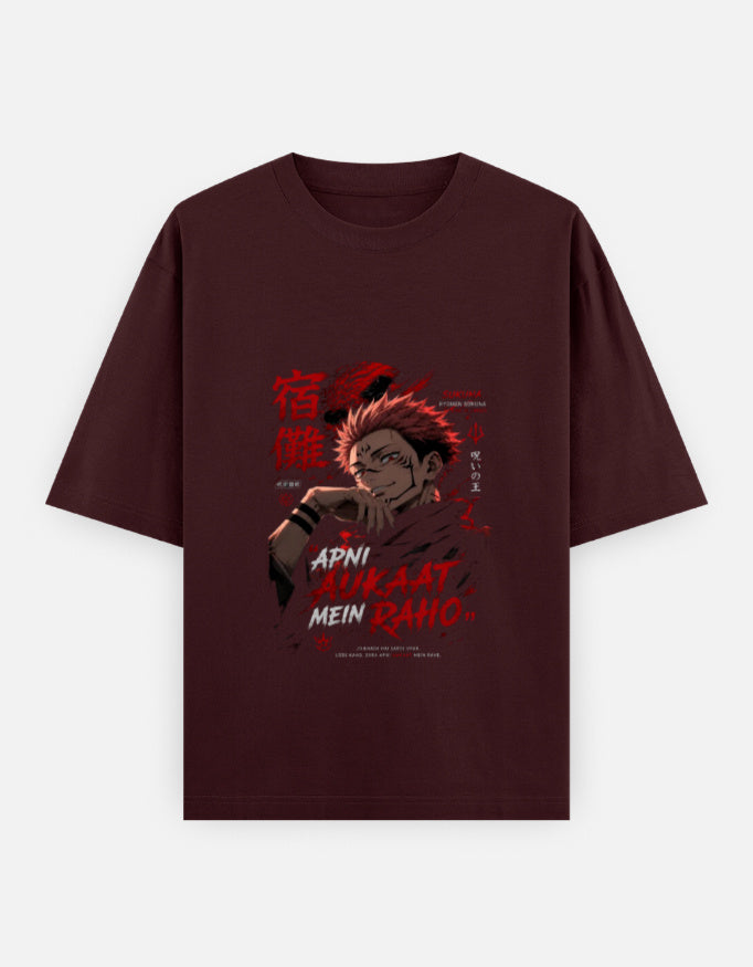 A dark maroon short-sleeve t-shirt with a graphic print of the anime character Jogo from Jujutsu Kaisen, featuring red Japanese kanji and text, displayed on a light gray background.