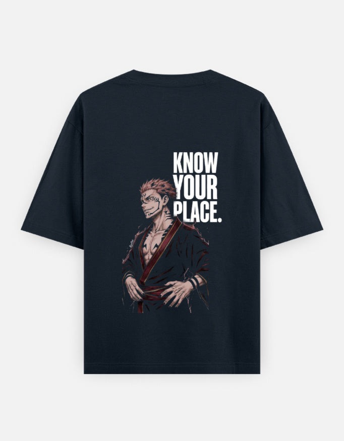 A dark navy blue short-sleeve t-shirt with a graphic print of an anime character and the bold white text 'KNOW YOUR PLACE.' on the back, displayed against a light gray background.