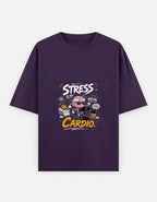 A dark purple short-sleeve t-shirt with a graphic on the chest that reads 'STRESS IS MY CARDIO.' in white and yellow text, featuring a cartoon character in a heart-shaped hat, shown on a light gray background.