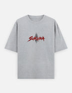A light gray heather crewneck t-shirt with a red and black stylized 'SUKUNA' graphic printed on the chest, displayed against a light gray background.