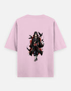 A light pink short-sleeve t-shirt with a graphic print of the anime character Itachi Uchiha in a black Akatsuki cloak with red cloud patterns, surrounded by black birds, shown on a light gray background.