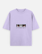 A light purple short-sleeve t-shirt featuring a graphic of the anime character Itachi Uchiha's eyes and the name 'ITACHI' printed below, displayed on a light gray background.