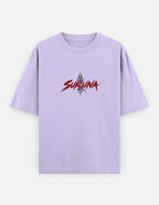 A light purple short-sleeve t-shirt with a red and black 'SURUNA' graphic printed on the chest, displayed against a light gray background.