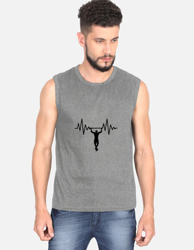 Man wearing a sleeveless dark gray shirt with text on a plain background