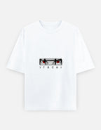 A white short-sleeve crewneck t-shirt featuring a graphic of the anime character Itachi Uchiha's eyes and the name 'ITACHI' printed below, displayed on a light gray background.